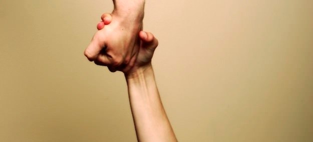 a hand reaching down to rescue someone.